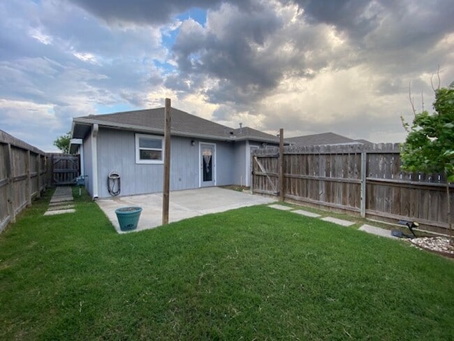 Building Photo - WELCOME TO YOUR CHARMING HOME AT THE COTTA...