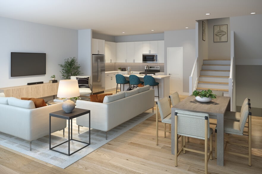 Townhomes featuring stainless steel appliances and seamless open concept kitchen, dining, and living spaces for modern living (Rendering) - Avalon Townhome Collection Arundel Mills