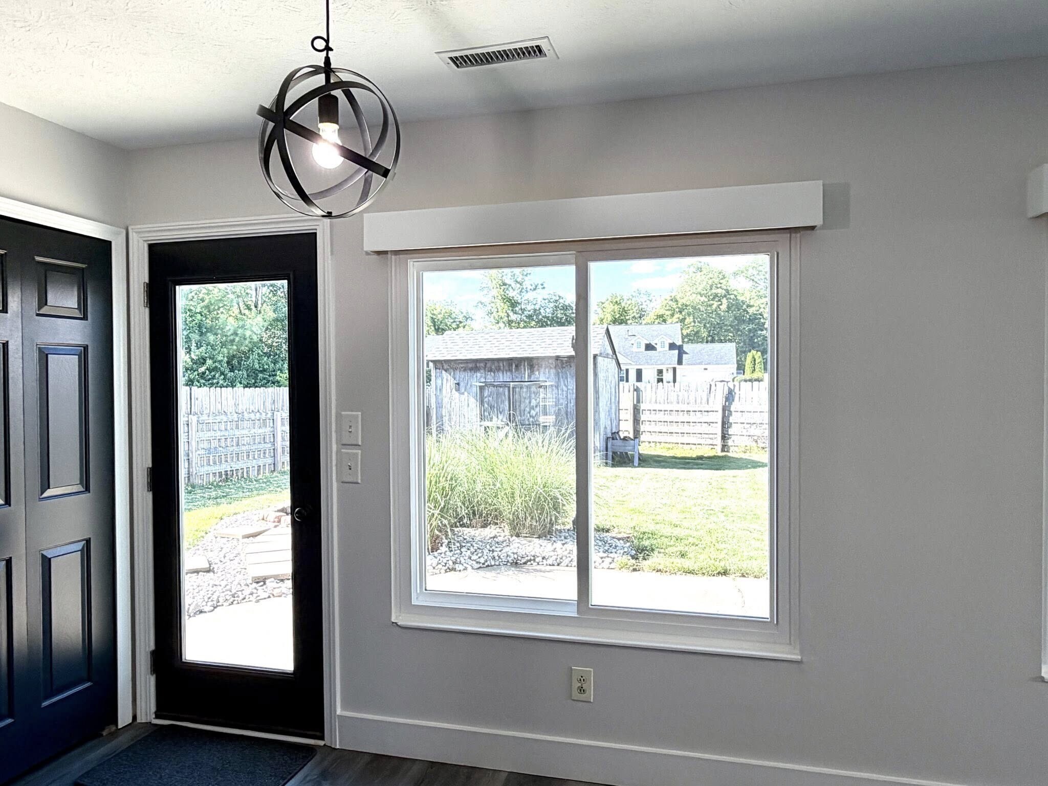 Dining area walks out onto a large, concrete patio and rear yard - 1200 Bugle Bluff Ct