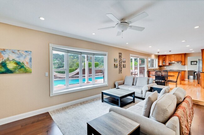 Building Photo - Remodeled 5 Bedroom Home with Heated Pool, Hillside Views, Solar, and Sunrise and Sunset Views in...