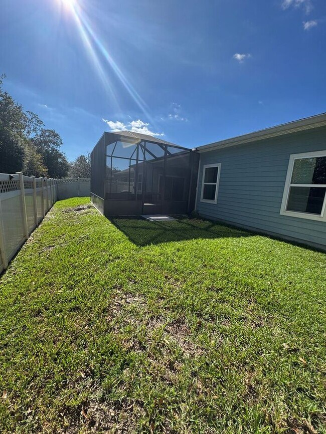 Building Photo - COMING SOON! Beautiful 4BR 3BA Home w/ Screened Lanai & Pond View • Garage Parking • Fenced Yard ...