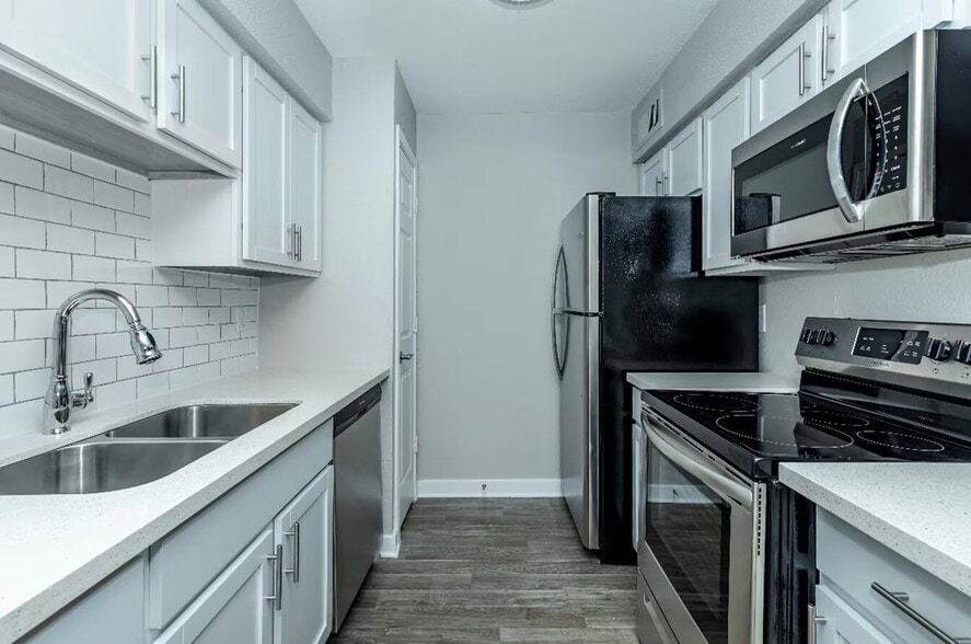 Experience modern living at Cali Crossing Apartments! Our updated kitchens feature sleek stainless steel appliances and stylish finishes, perfect for culinary adventures. Elevate your lifestyle today—schedule a tour and see for yourself! - Cali Crossing Apartments