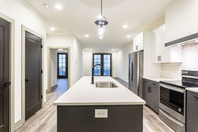 Building Photo - Modern Living Meets Walkable City Charm in...