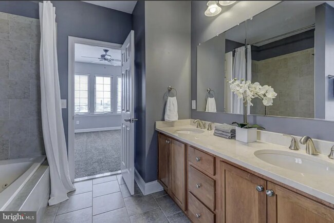 Building Photo - Beautiful EOG 3 bedroom  2.5 bath townhome with a 2 car garage and roof top deck overlooking the ...