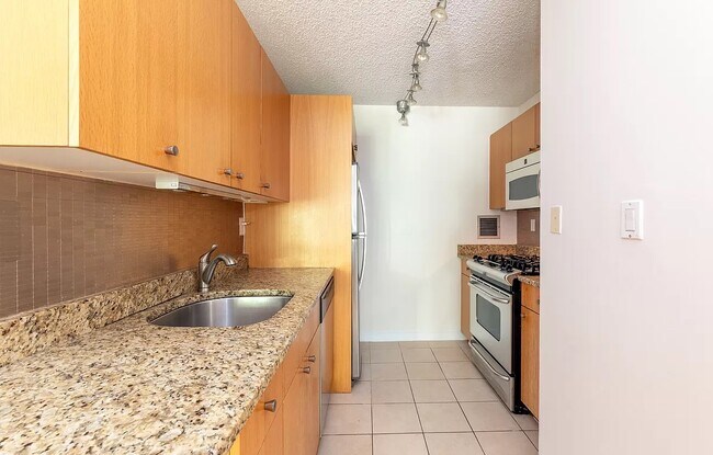 Building Photo - Sleek, Modern Unit Available Now