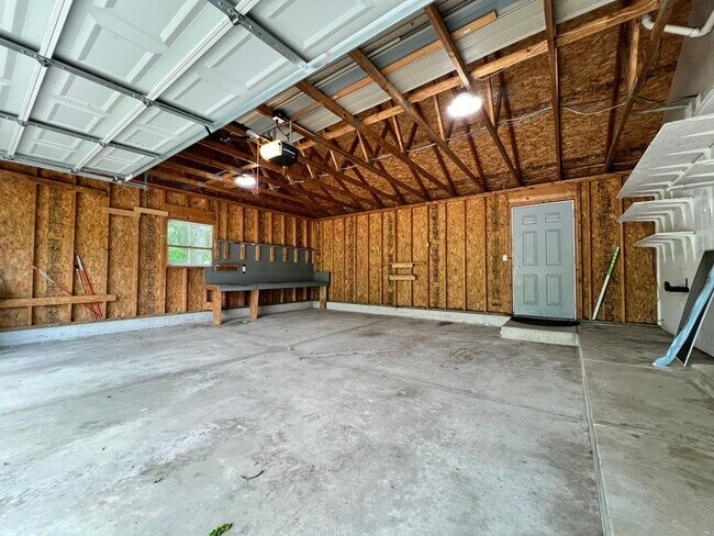 Building Photo - Spacious 3BR Duplex with Finished Basement & 2-Car Garage in Otsego