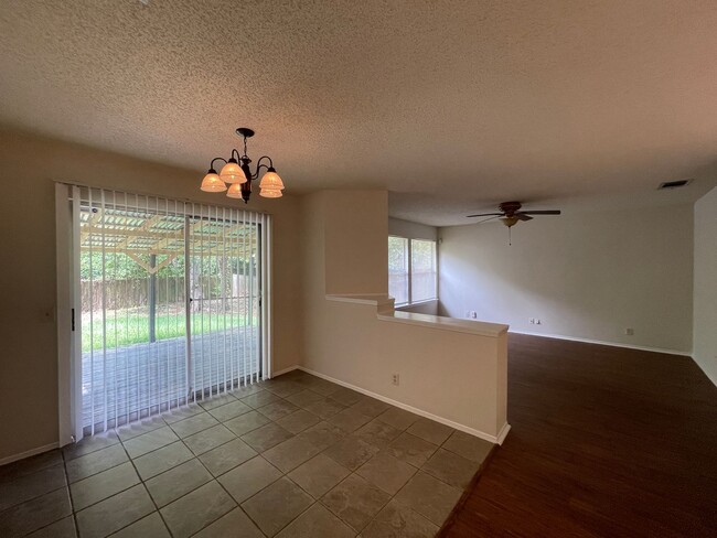 Building Photo - SPACIOUS HOME - NEW FLOORING! - 2 LIVING A...