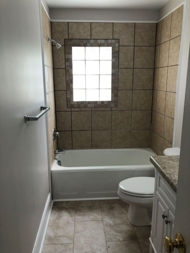 Building Photo - Just off the main road, but in walking distance to everything!