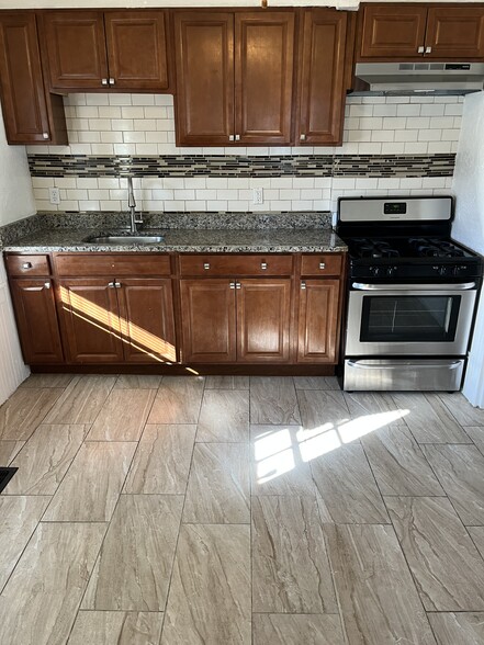 Granite Countertops, Stainless Steel Stove and Range Hood - 52 Germain Ave