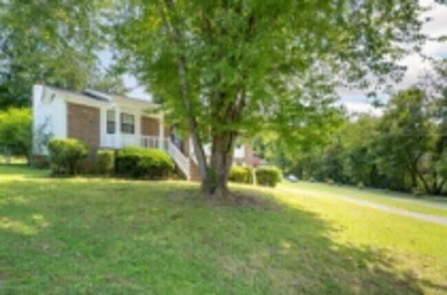 Building Photo - This beautifully updated brick home in Har...