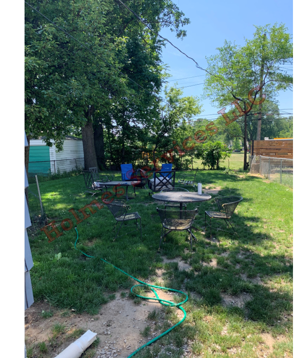 Fenced-in backyard. City of Ferndale park behind property - 524 Academy St