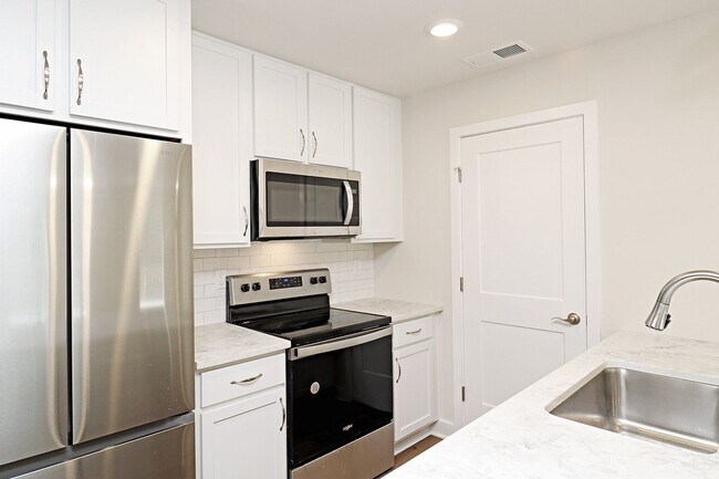Building Photo - $1,000 Off 1st Month's Rent! Dog-Friendly End-Unit Apartment