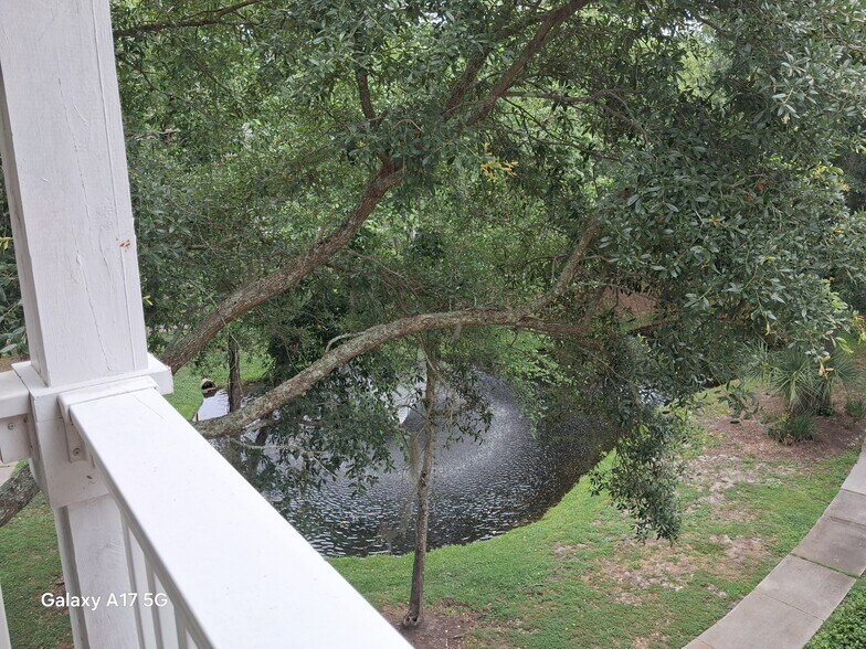 Lagoon can be seen from both bedrooms, balcony, and living room - 100 Kensington Blvd