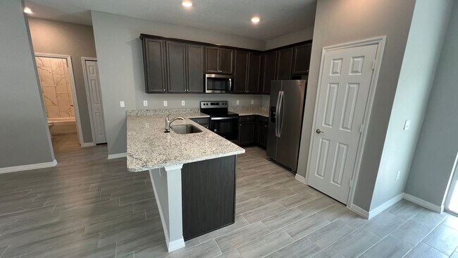 Building Photo - Smart & Stylish 3BD/2BA Palm Bay Home – Modern Upgrades, No Water Bills!
