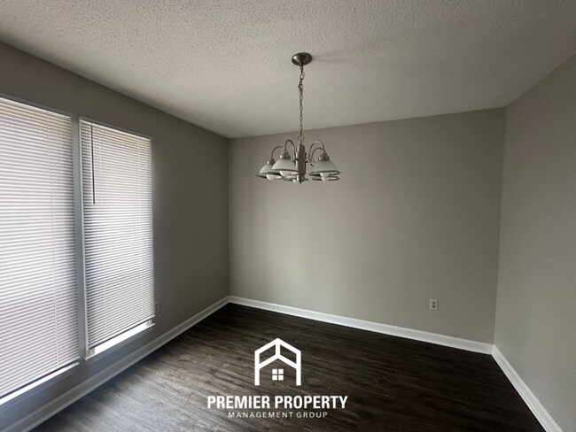 Building Photo - Charming 3BR Memphis Home | Rustic Brick Fireplace, Formal Dining & Fenced Backyard