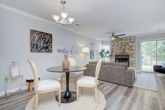 Building Photo - Discover this beautifully updated Raintree townhome featuring an open floor plan and a range of c...