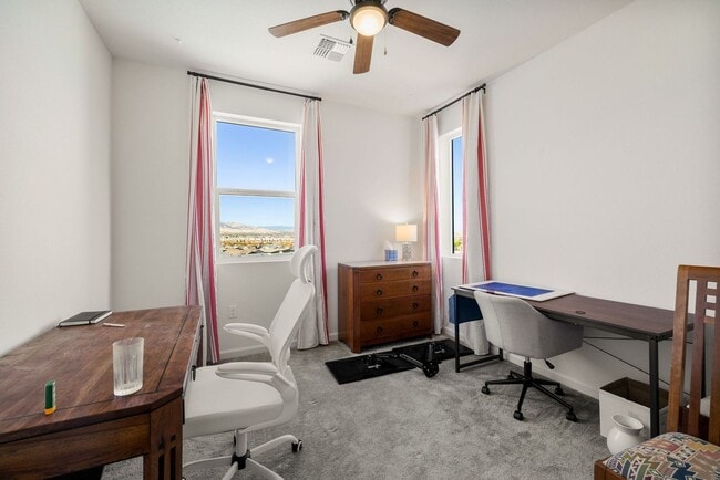 Building Photo - Beautiful 4BR/4BA home in the gated Copper View community. Features spacious living areas, mounta...