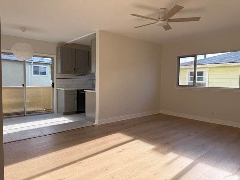 Living room, peek of kitchen and patio - 1533 Princeton St