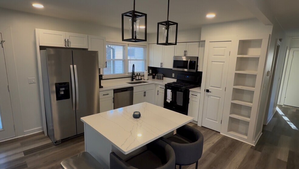 A fully equipped kitchen with modern appliances, plenty of counter space, and everything you need to - 2394 Bouldercliff Way SE