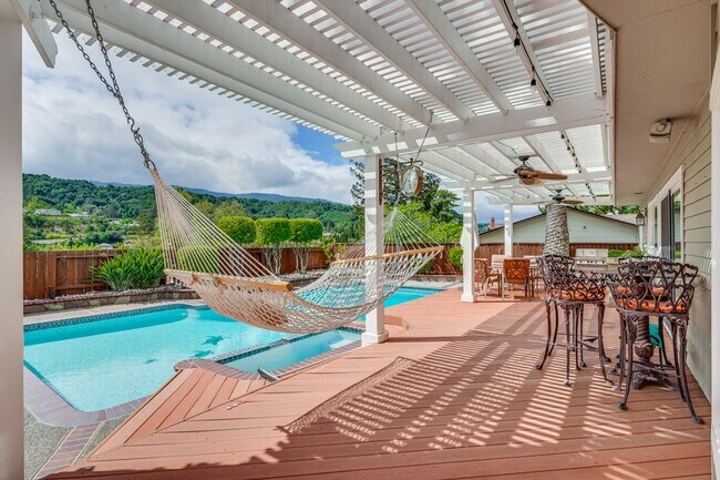 Building Photo - Remodeled 5 Bedroom Home with Heated Pool, Hillside Views, Solar, and Sunrise and Sunset Views in...