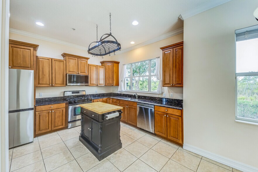 kitchen with new appliances - 1408 3rd Street Cir E