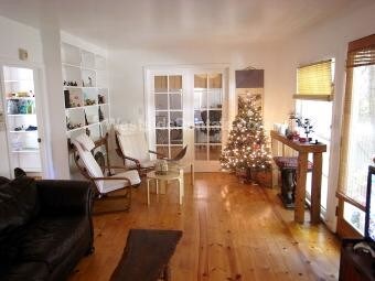 Living room with French doors to bedroom 1 - 3626 Veteran Ave