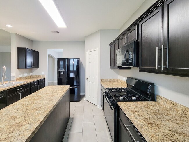 Building Photo - Welcome to this charming one-story home fe...