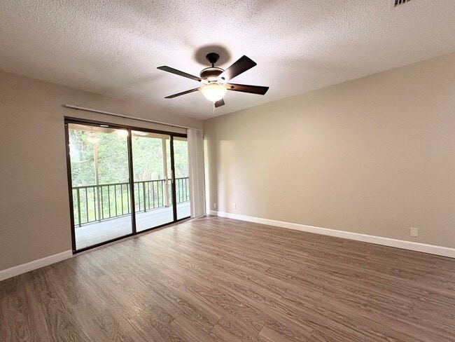 Building Photo - Beautiful Corner Unit with Vinyl Plank Flooring & Private Screened Patio