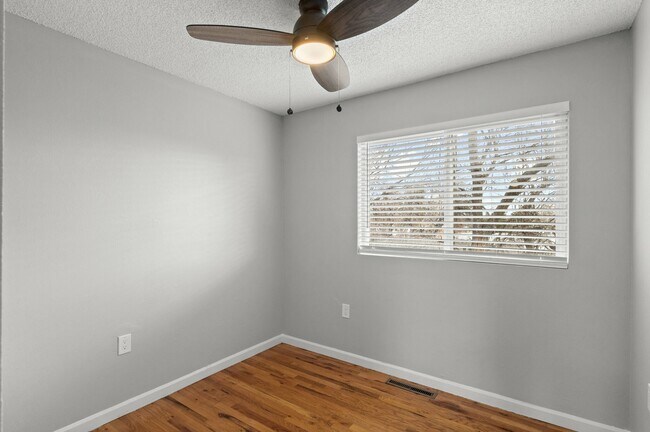 Embrace the simplicity of this bright and airy bedroom, perfect for creating your personal retreat. - 5580 West 4th Avenue Townhomes