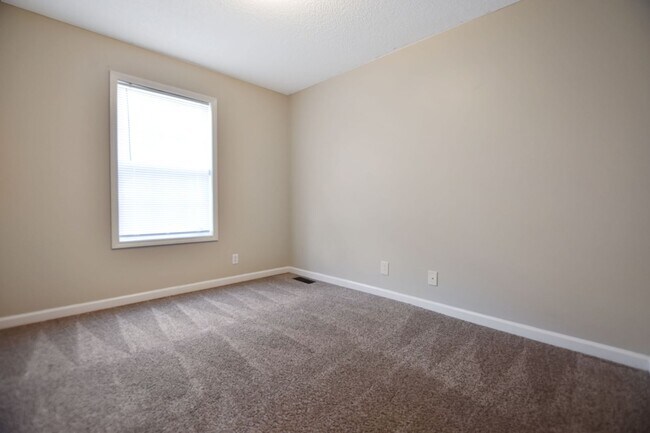 Building Photo - Pet Friendly Three Bedroom with Bonus!