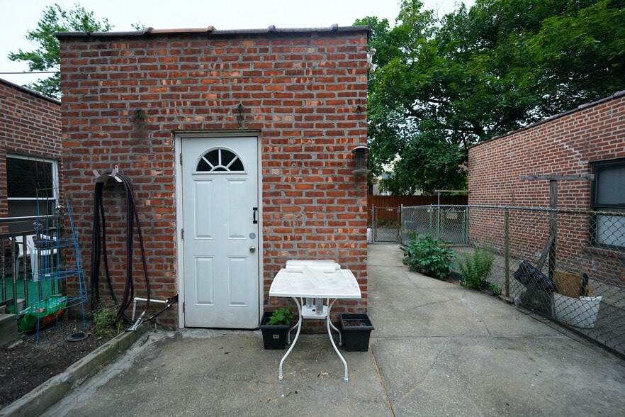 Detached garage - pic from patio - 6776 Dartmouth St
