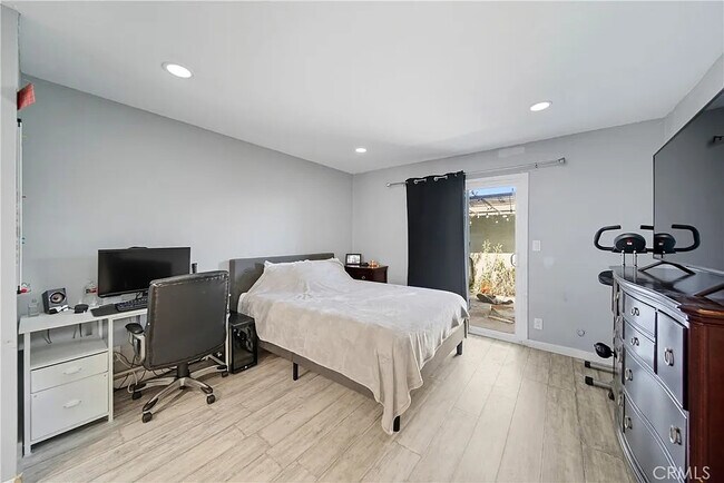 Building Photo - Bright 2-Bed Condo with Central Air, Pool Access & Carport in Anaheim