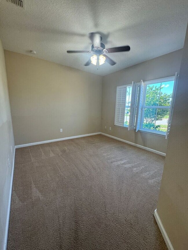 Building Photo - COMING SOON! Beautiful 4BR 3BA Home w/ Screened Lanai & Pond View • Garage Parking • Fenced Yard ...