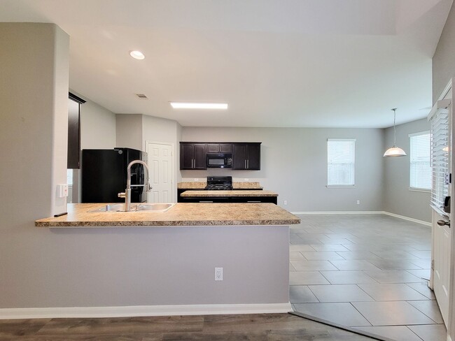 Building Photo - Welcome to this charming one-story home fe...