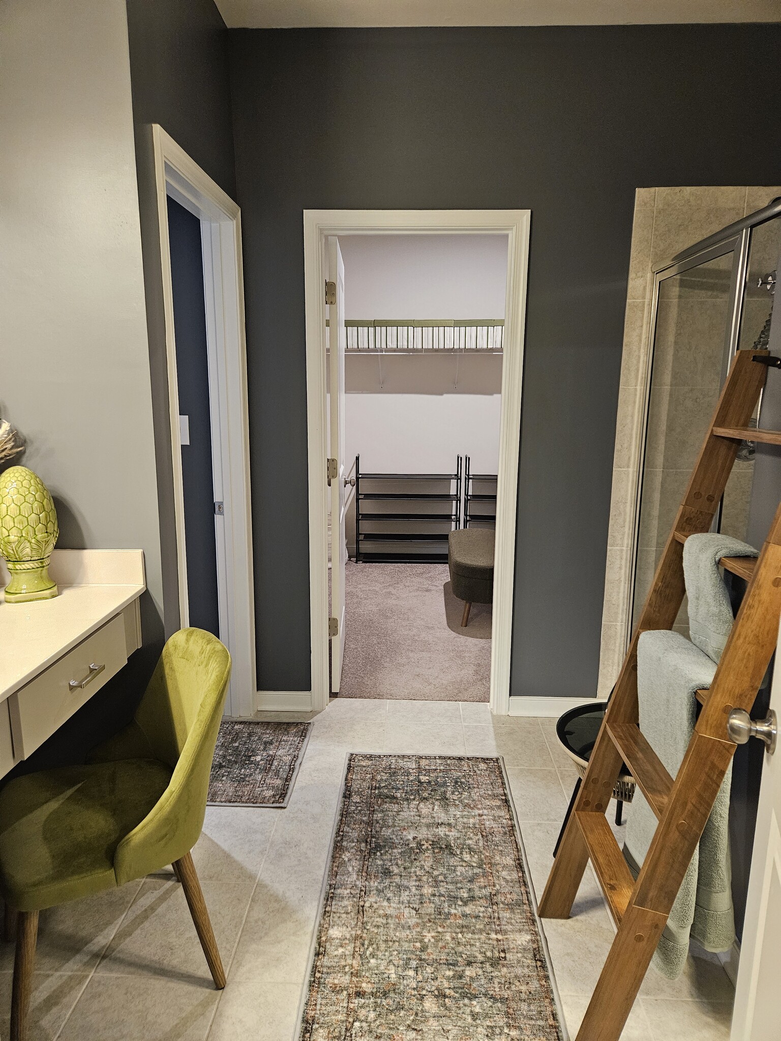 a walk through bathroom leading to the closet and the thrown room - 7201 Hancock Chase Ct
