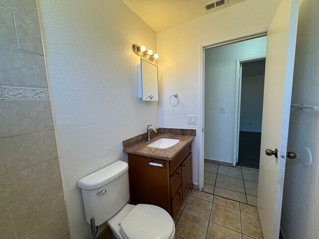 Building Photo - Two Bed, One Bath Triplex with a One Car Garage In North Stockton