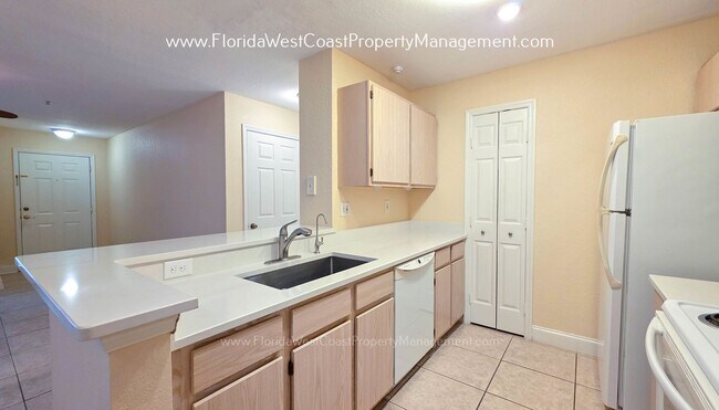 Building Photo - MOVE IN READY! LARGE 2 BEDROOM/2 BATH PLUS ATTACHED GARAGE! TILE/LVP THROUGHOUT!