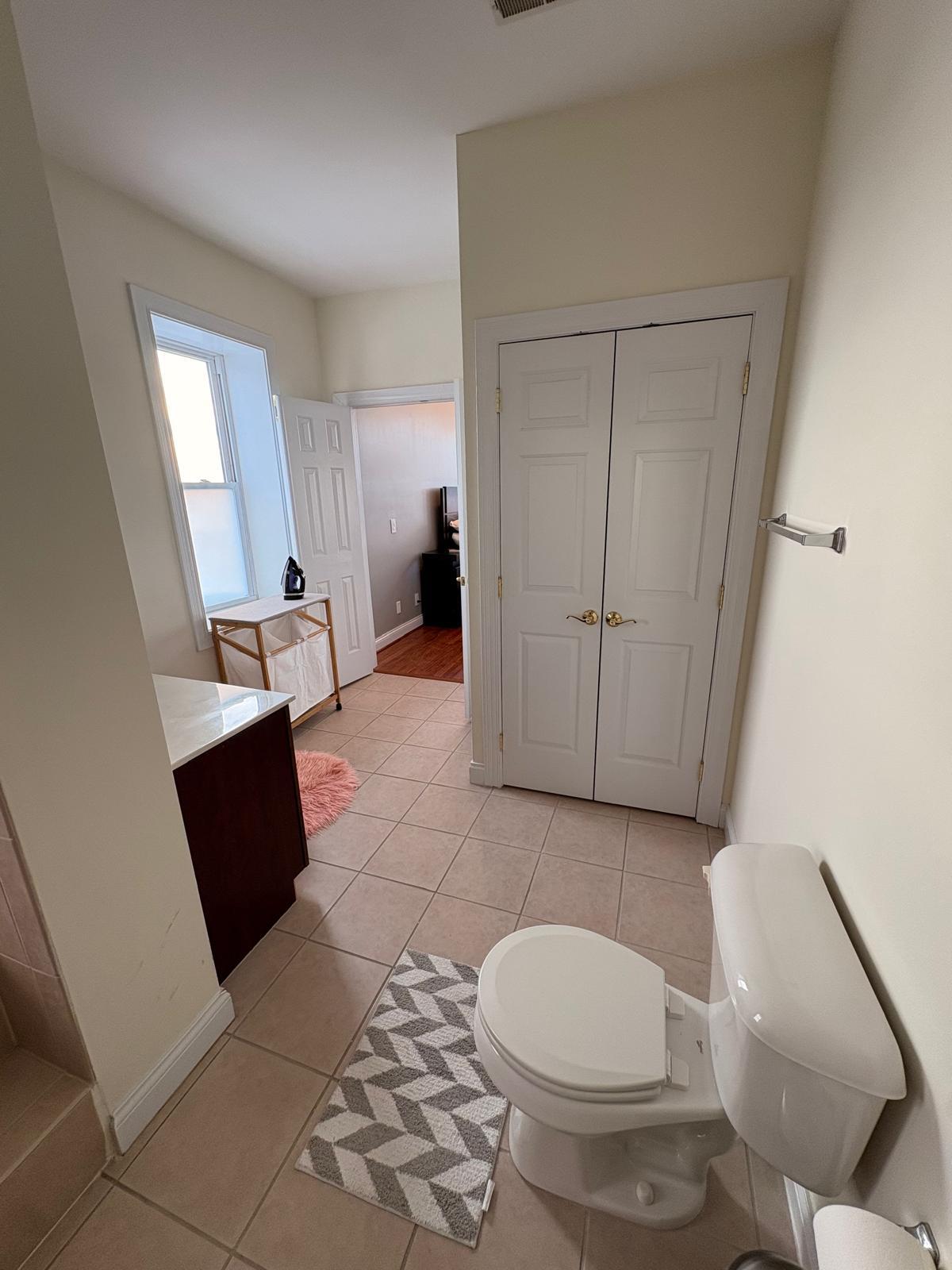 Primary bathroom with linen closet - 1925 Auburn Ave
