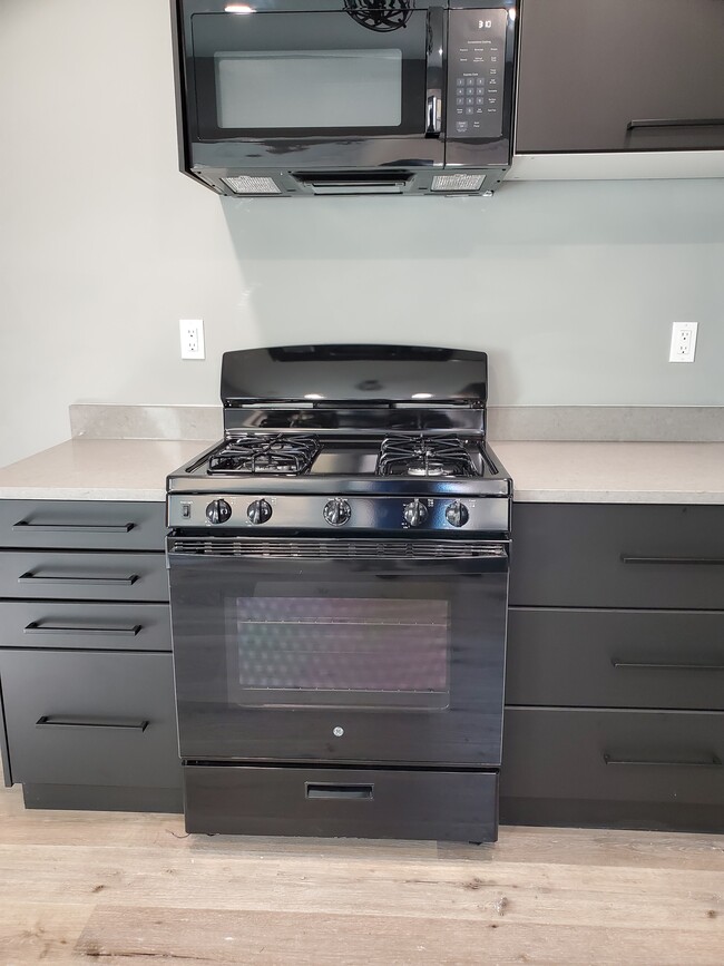 Brand new GE gas stove with plenty of storage - 579 W. 13th St