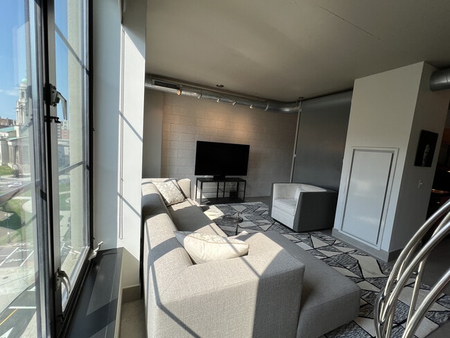 Living Room with CB2 rug and Mitchell Gold & Bob William Accent chair - 1133 14th St NW