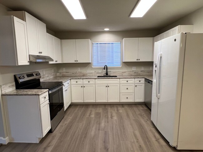 Building Photo - NEWLY REMODELED! 3+ bed, 1.5 bath, a/c, d/w, lots of off street parking!