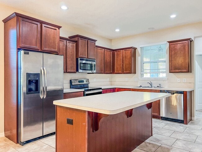 Building Photo - Spacious 4-Bedroom Townhome in Harmony – A Perfect Blend of Nature & Comfort!