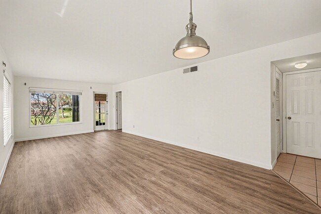 Building Photo - Must see 1st floor, end unit with lots of natural light in St Lucie Gardens.