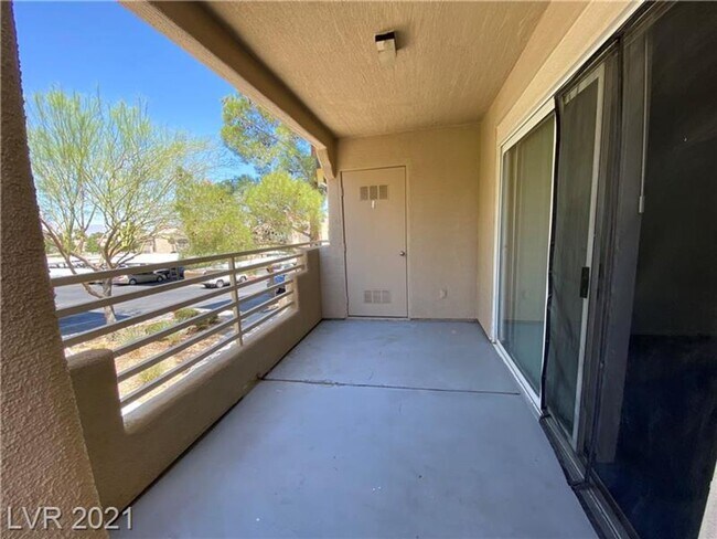 Building Photo - Cozy 1-Bed Condo in Gated 89128 Community ...
