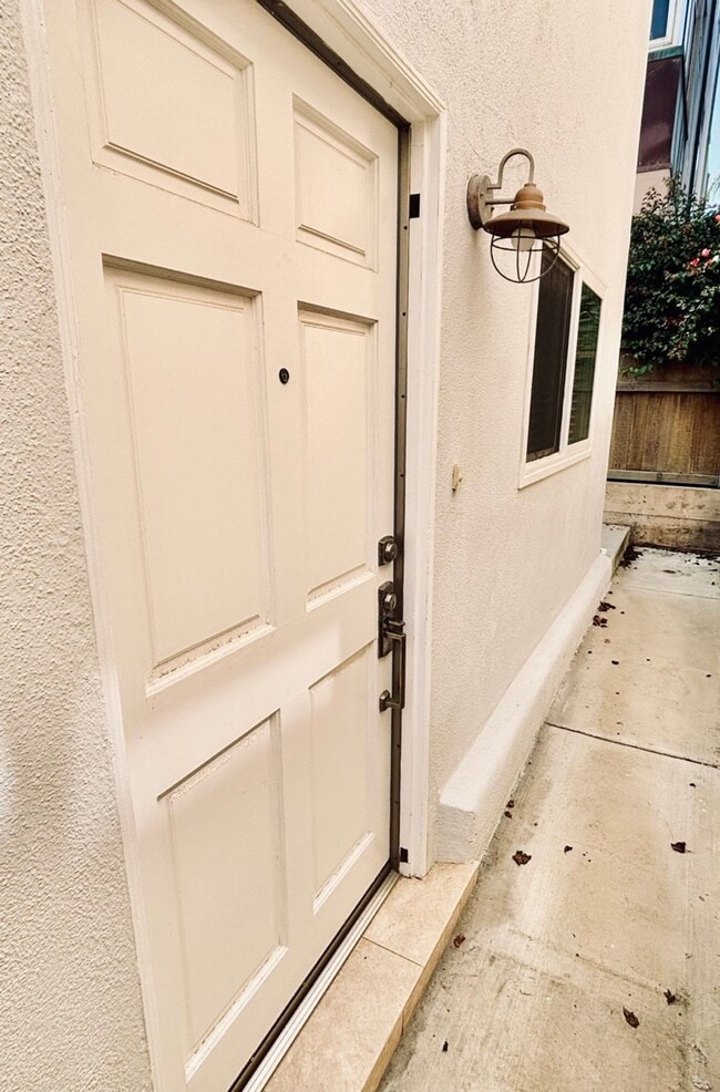 Building Photo - Beachside Living Just One Block from the Sand – Updated 1BD with Garage Parking