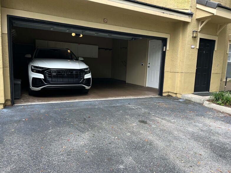 2 CAR W/ CABINETS + BIKE RACKS - 219 Villa Di Este Ter