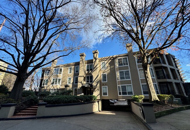 front of building at 14th Street entrance, with gated entry to garage - 209 14th St. NE #119