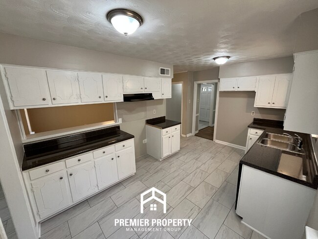 Building Photo - NEWLY RENOVATED 4BR/2BA Whitehaven Home | Detached 2-Car Garage & Tile Floors