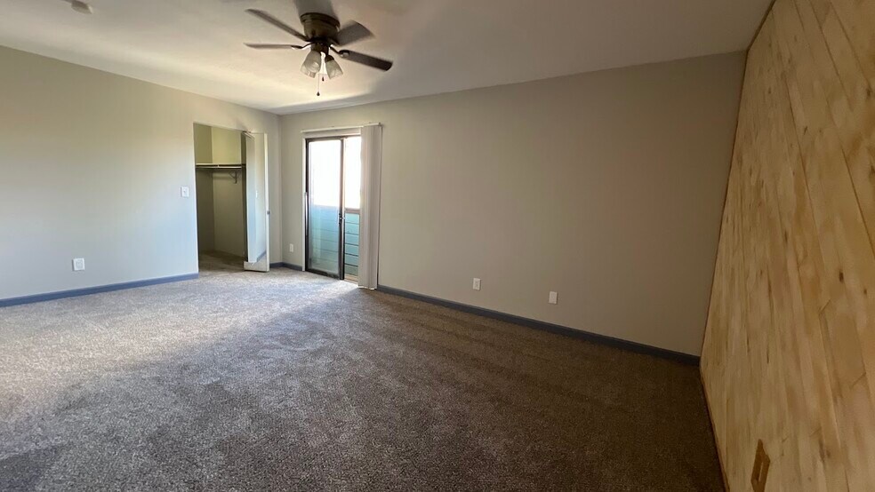 Spacious primary bedroom. - 12063 E Harvard Ave