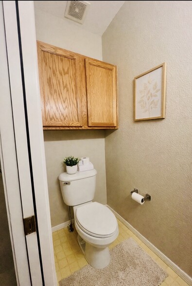 Convenient main-level half bath with updated LVP flooring scheduled for installation. Decor shown is - 2563 Malpaso Pt